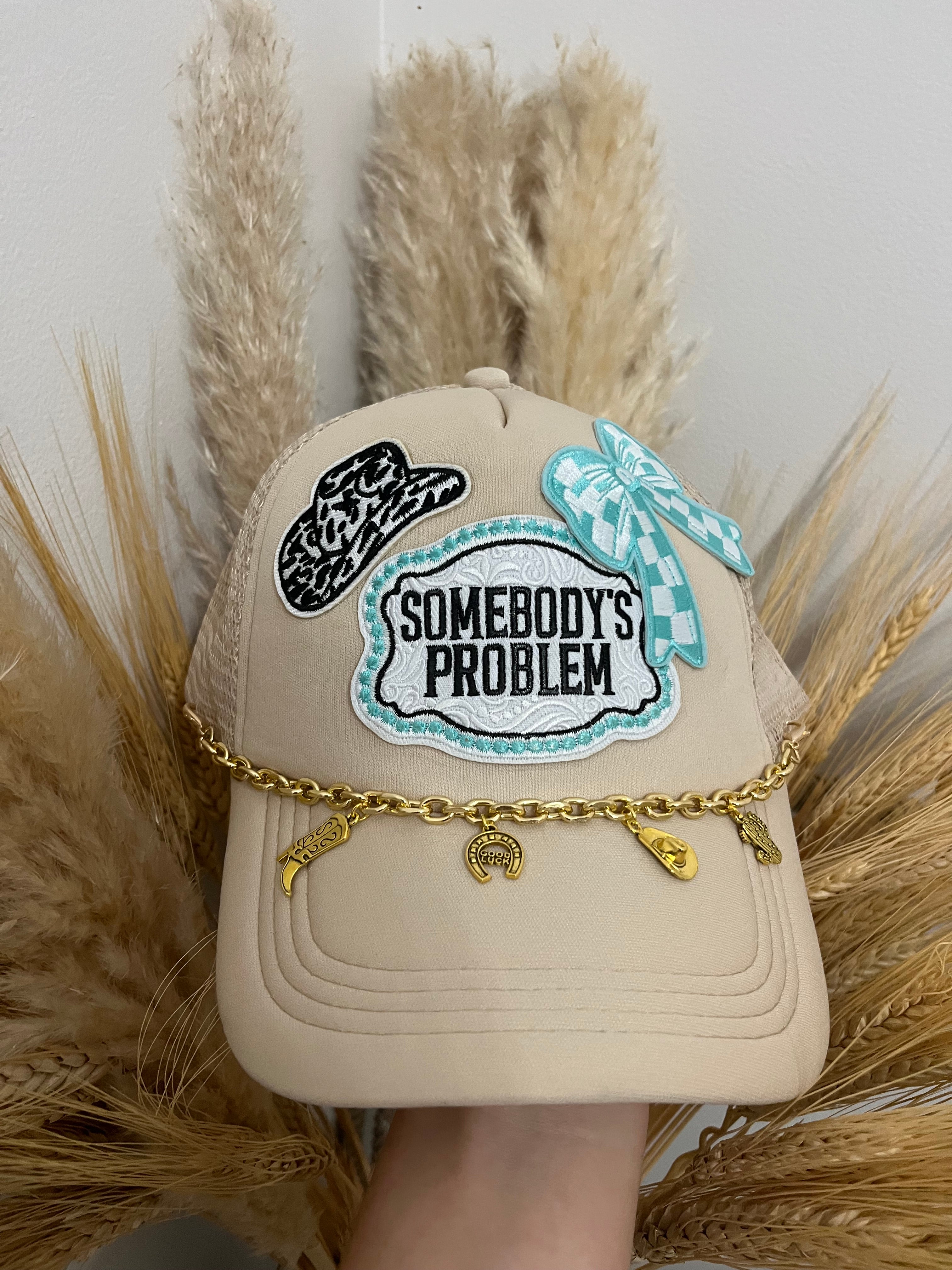 “Somebody’s Problem” Charm Trucker Hat